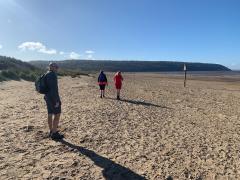 Heading down the beach - Weston is round the woody point in the distance.